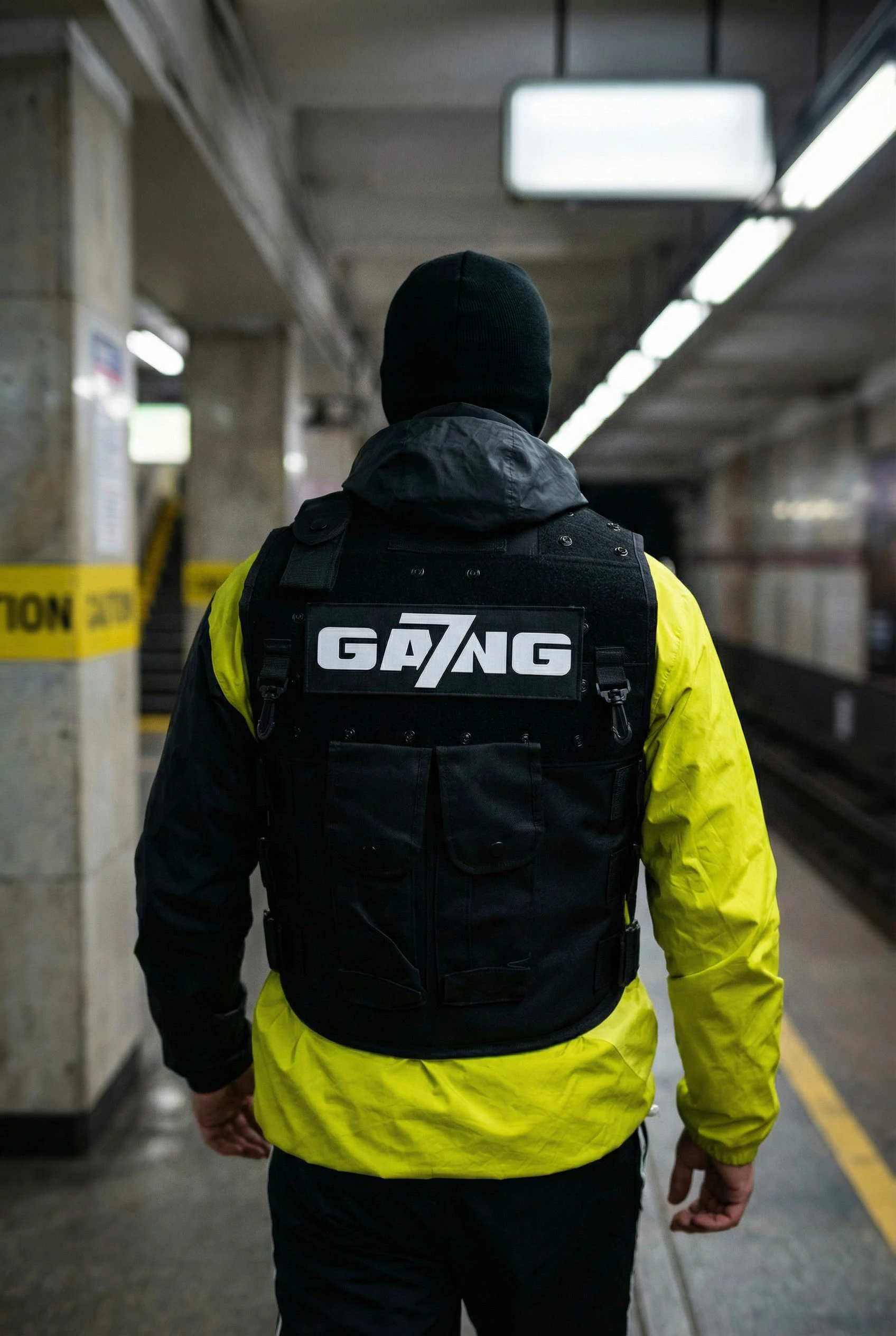 gemini-image-2_male_model_fast_walk_in_subway_corridor_background_motion_blur_subject_sharp_bla-2.jpg
