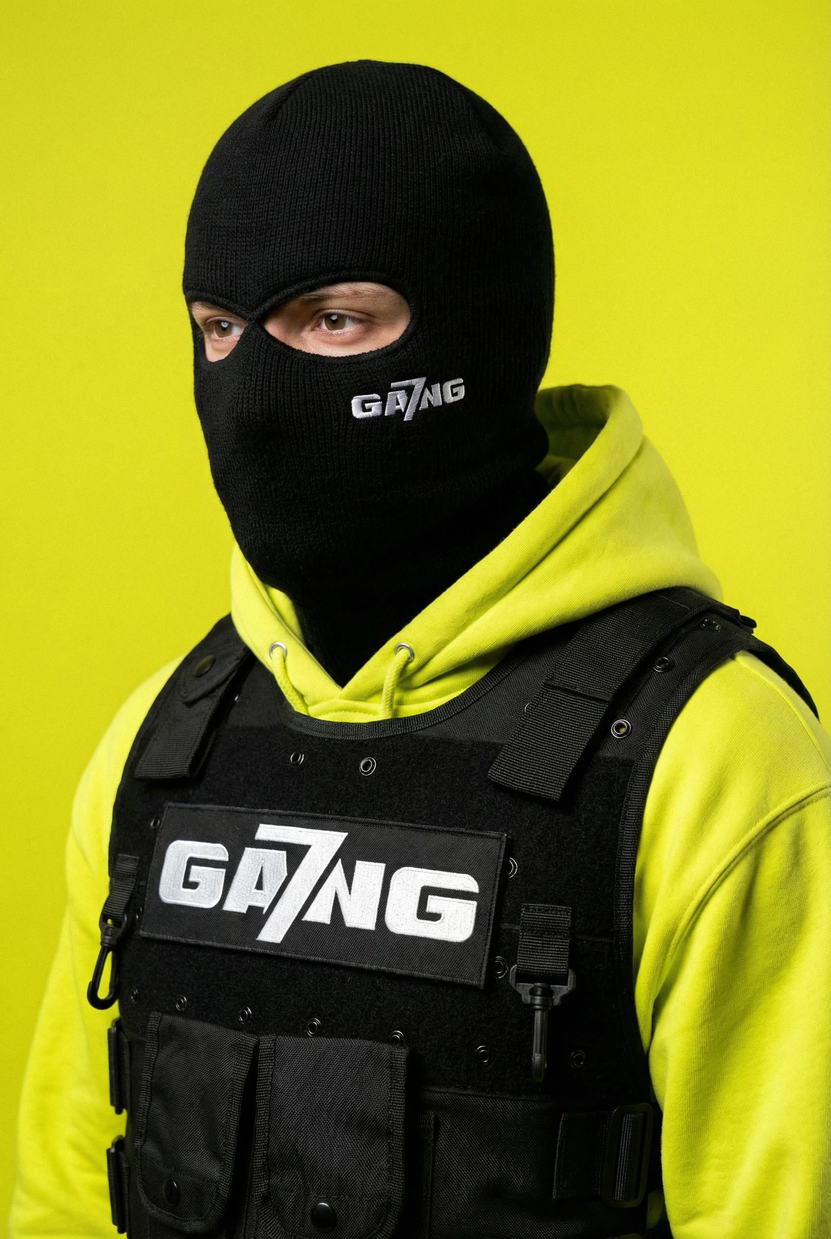 gemini-image-2_studio_portrait_black_balaclava_with_subtle_embroidered_“GA7NG”_mark_neon_ye-3.jpg