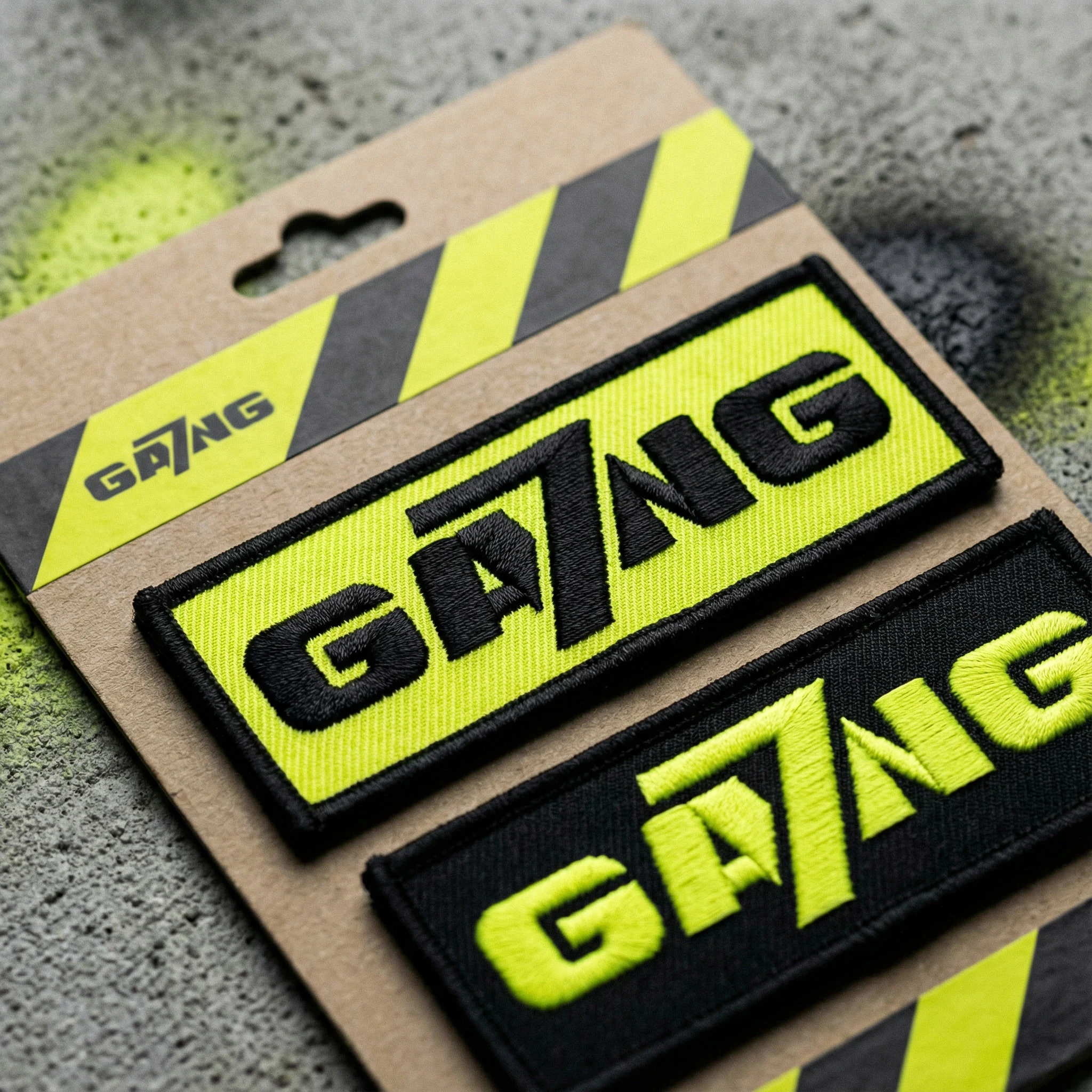 gemini-image-2_embroidered_velcro_patches_“GA7NG”_on_backing_card_neon_yellow_plus_black_pa-0.jpg