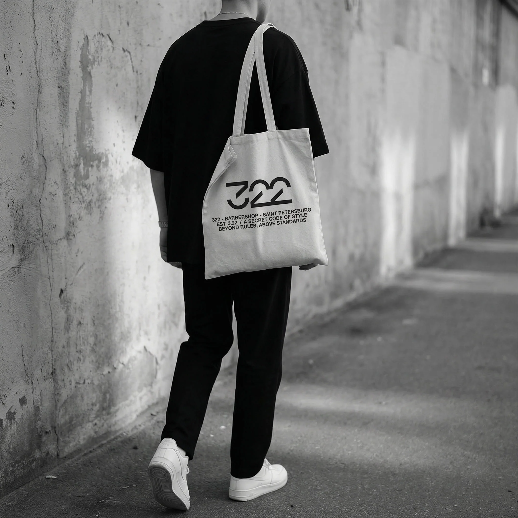 gemini-image-2_A_stylish_minimal_street_photography_scene._A_person_walks_along_a_concrete_wall-3.jpg